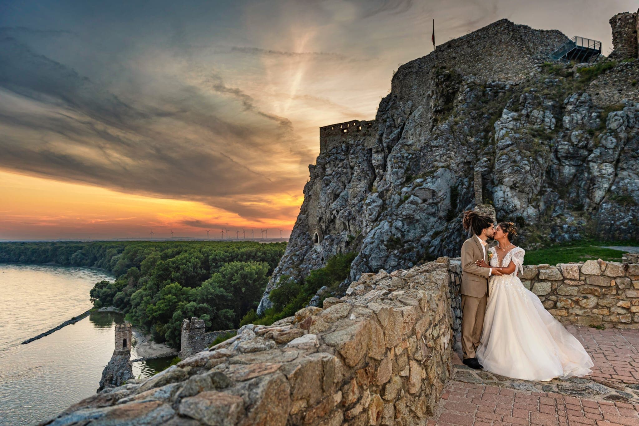 View of a married couple during a wedding photo shoot at Devín Castle