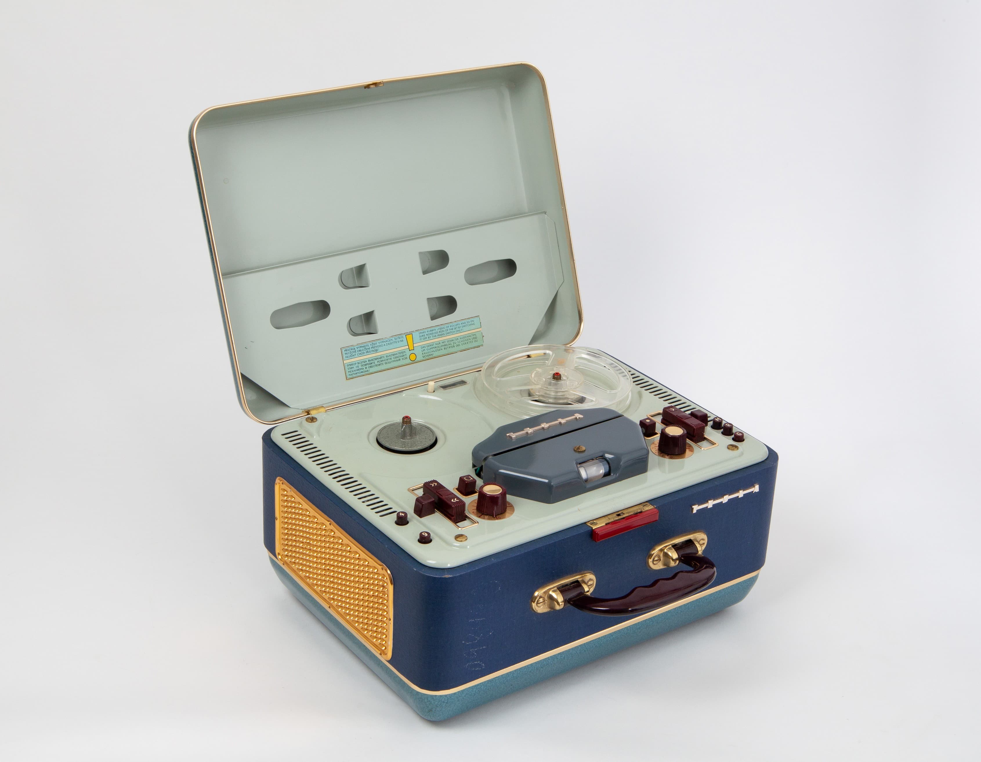 A portable reel-to-reel tape recorder in a suitcase-style case. 